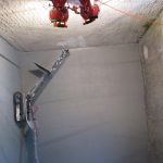 Remote climbing platform from ICM applying fixative inside hot cell testbed