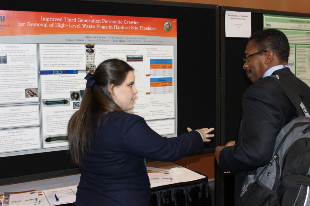 DOE Fellow Gabriela Vazquez presenting her research at the Waste Management Symposium in 2013 to Mr. Desi Crouther (Director - DOE EM Office of Human Capital)