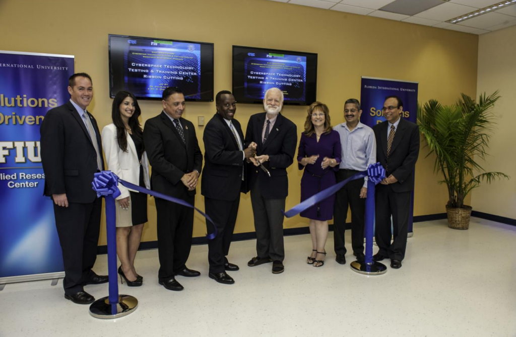From left to right: Mr. Brian Fonseca (Director of Operations, ARC), Ms. Alessandra Monetti (Engineer, SRC in support of TRMC), Dr. Leonel Lagos (CT3C Program Director and Director of Research, ARC), Mr. G. Derrick Hinton, SES (Principal Deputy Director, TRMC), Dr. Douglas Wartzok (Provost & Executive Vice President, FIU), Dr. Inés Triay (Executive Director, ARC), Dr. Shekhar Bhansali (Chair, Electrical and Computer Engineering Department, FIU), Mr. Himanshu Upadhyay (IT Program Manager, ARC)