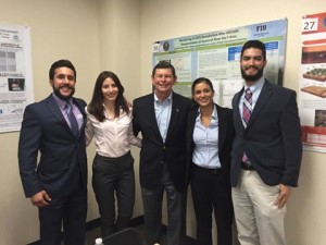 FIU STEM Students and DOE Fellows (Aref, Kiara, Christine, and Christian) with Indian River State College President, Dr. Edwin Massey