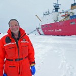 Dr. Kadko at the North Pole with the US Healy on the background