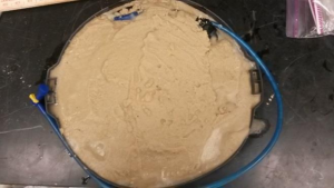 Fig. 4. Same air bladder covered with paver sand to create object to be imaged by the 3D sonar.