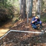 DOE Fellow Juan Morales installing a remote monitoring stations at SRS