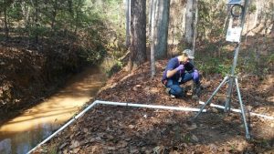 DOE Fellow Juan Morales installing a remote monitoring stations at SRS