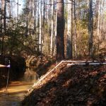 DOE Fellow Juan Morales installing a remote monitoring stations at SRS